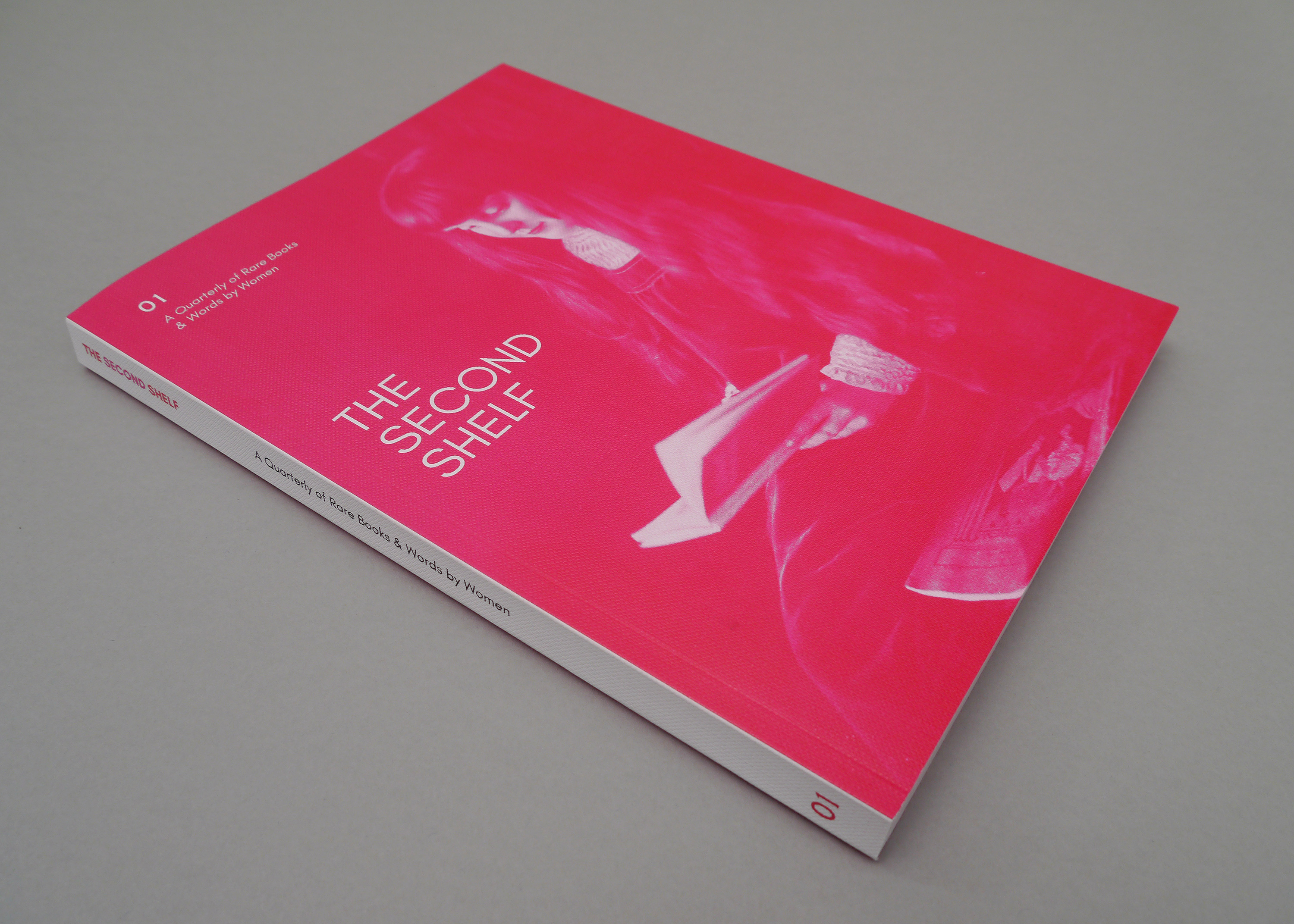 Bright pink portrait format booklet with embossed cover